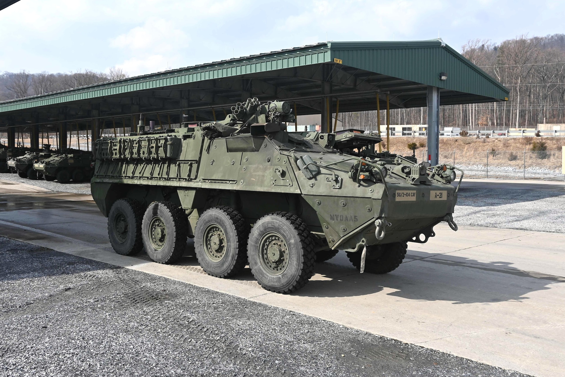 An upgraded double-V hull Stryker is moved from a storage yard to a maintenance bay at Fort Indiantown Gap, Pa., on Feb. 27, 2005. The 56th Stryker Brigade Combat Team is receiving 324 upgraded Strykers and 300 Joint Light Tactical Vehicles as part of a program to modernize the brigade. (Pennsylvania National Guard photo by Brad Rhen)