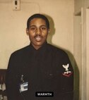 U.S. Air Force Col Rofelio Grinston, 5th Maintenance Group commander, poses for a photo when he was a Petty Officer in the U.S. Navy.