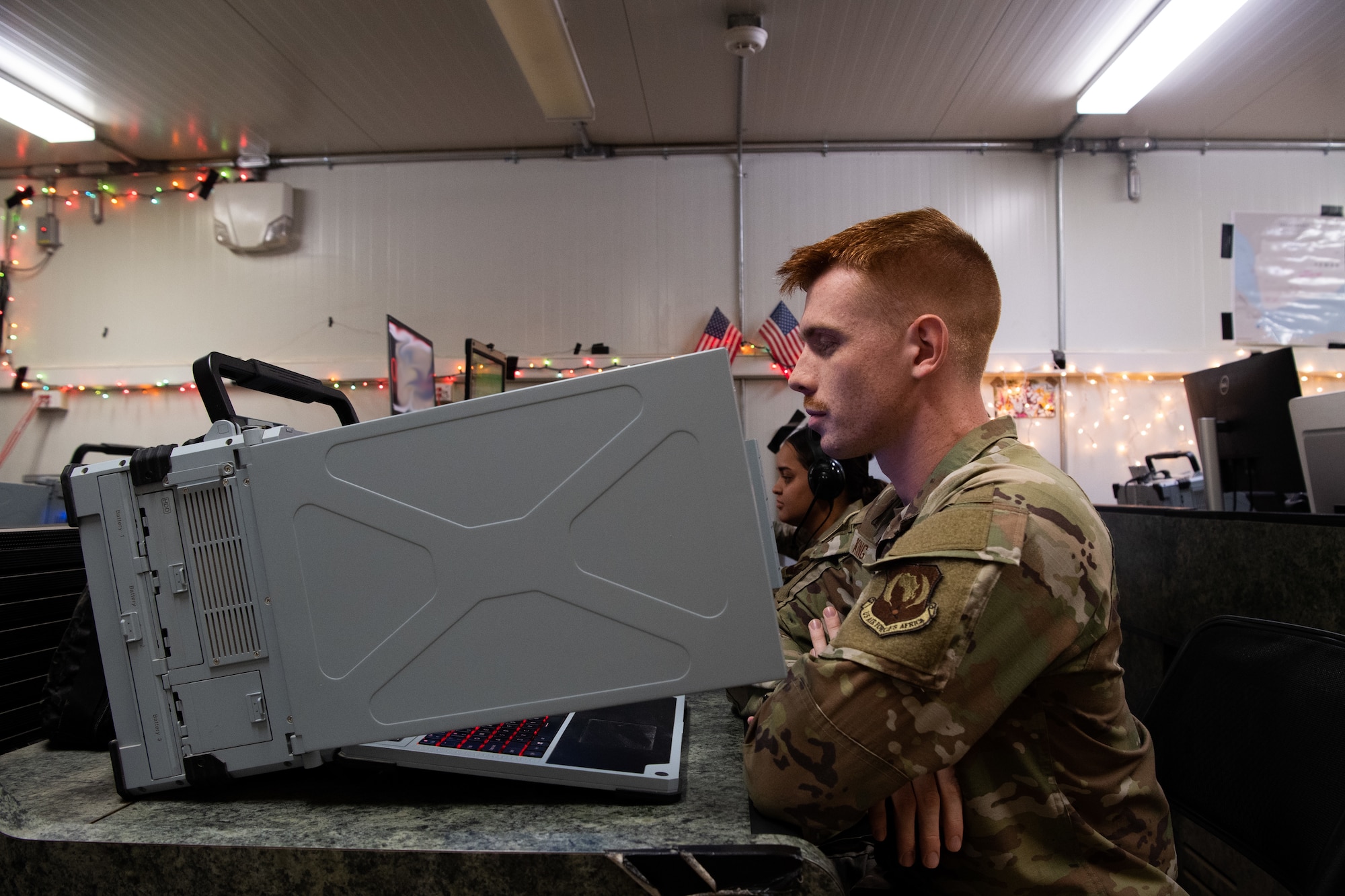 U.S. Air Force Senior Airman Christopher King, 606th Air Control Squadron mission support operator, works on the Tactical Operations Control - Light command and control system at Camp Lemonnier, Djibouti, Feb. 17, 2025. The TOC-L system is a new command-and-control node designed to be rapidly deployable and maneuverable with the purpose of allowing the battle management team and sensor operators the ability to build and provide a common operating tactical air picture that assists with ensuring the safety deconfliction of flight for friendly and civilian aircraft in the area of responsibility. (U.S. Air Force photo by Staff Sgt. Noah Sudolcan)
