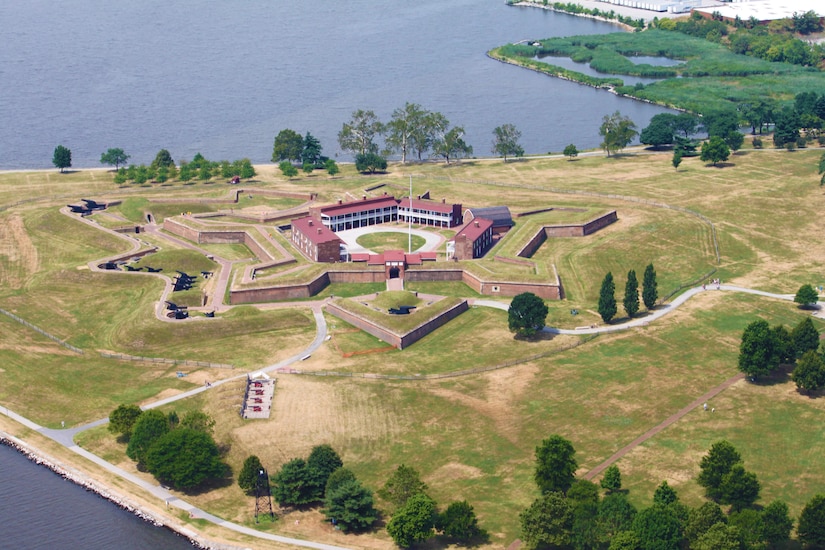 An aerial view of a fort on the water.