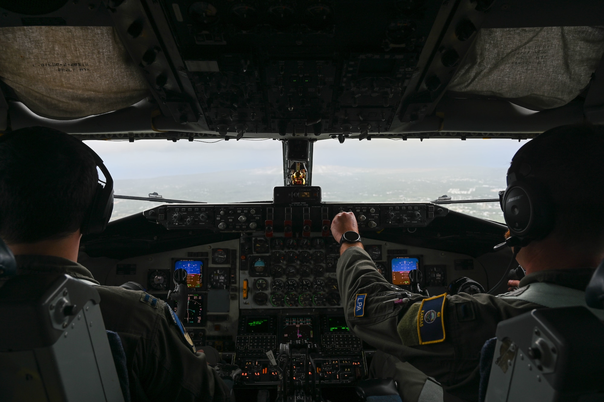 U.S. Air Force Capt. Payton Haefner, pilot, and 1st Lt. Jacob Long, copilot, 506th Expeditionary Air Refueling Squadron (EARS), prepare to land a KC-135 Stratotanker on Andersen Air Force Base, Guam, Feb. 26, 2025. The 506 EARS crew conducted a refueling mission with four U.S. Marine Corps F/A-18C Hornets assigned to Marine Fighter Attack Squadron 312, Marine Corps Air Station, Iwakuni, Japan. (U.S. Air Force photo by Airman 1st Class Natasha Ninete)