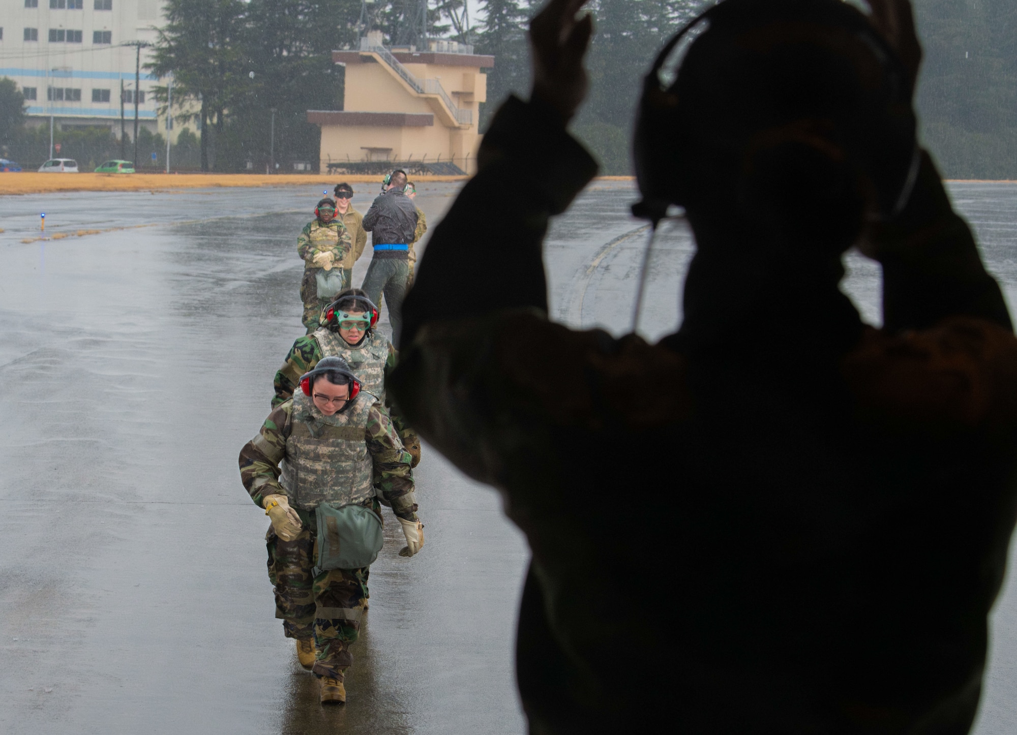 U.S. Air Force Airmen assigned to the 374th Medical Group prepare to receive simulated patients.