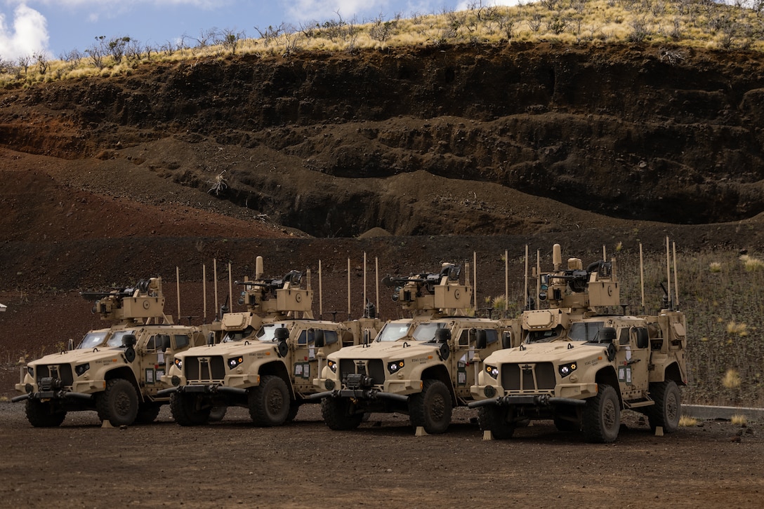 Joint Light Tactical Vehicles with Marine Air Defense Integrated Systems are staged during a training exercise at Pohakuloa Training Area, Hawaii, Jan. 25, 2025. A key component of the Marine Corps’ Force Design initiative, the mobile MADIS increases 3d Marine Littoral Regiment’s tactical flexibility by extending the range of the airspace which 3d MLR is able to sense and defend without support from the Joint Force. (U.S. Marine Corps photo by Sgt. Jacqueline C. Parsons)