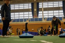 Participants throws a stone