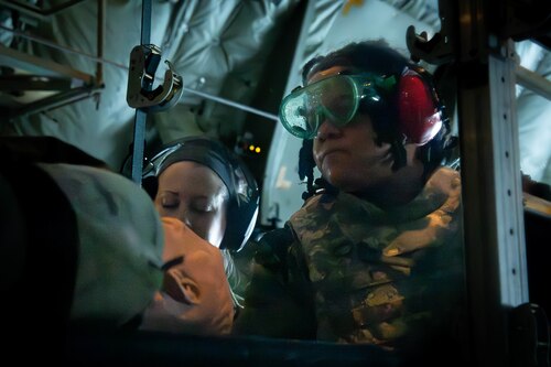 U.S. Air Force Airmen assigned to the 374th Medical Group prepare to deboard simulated patients.