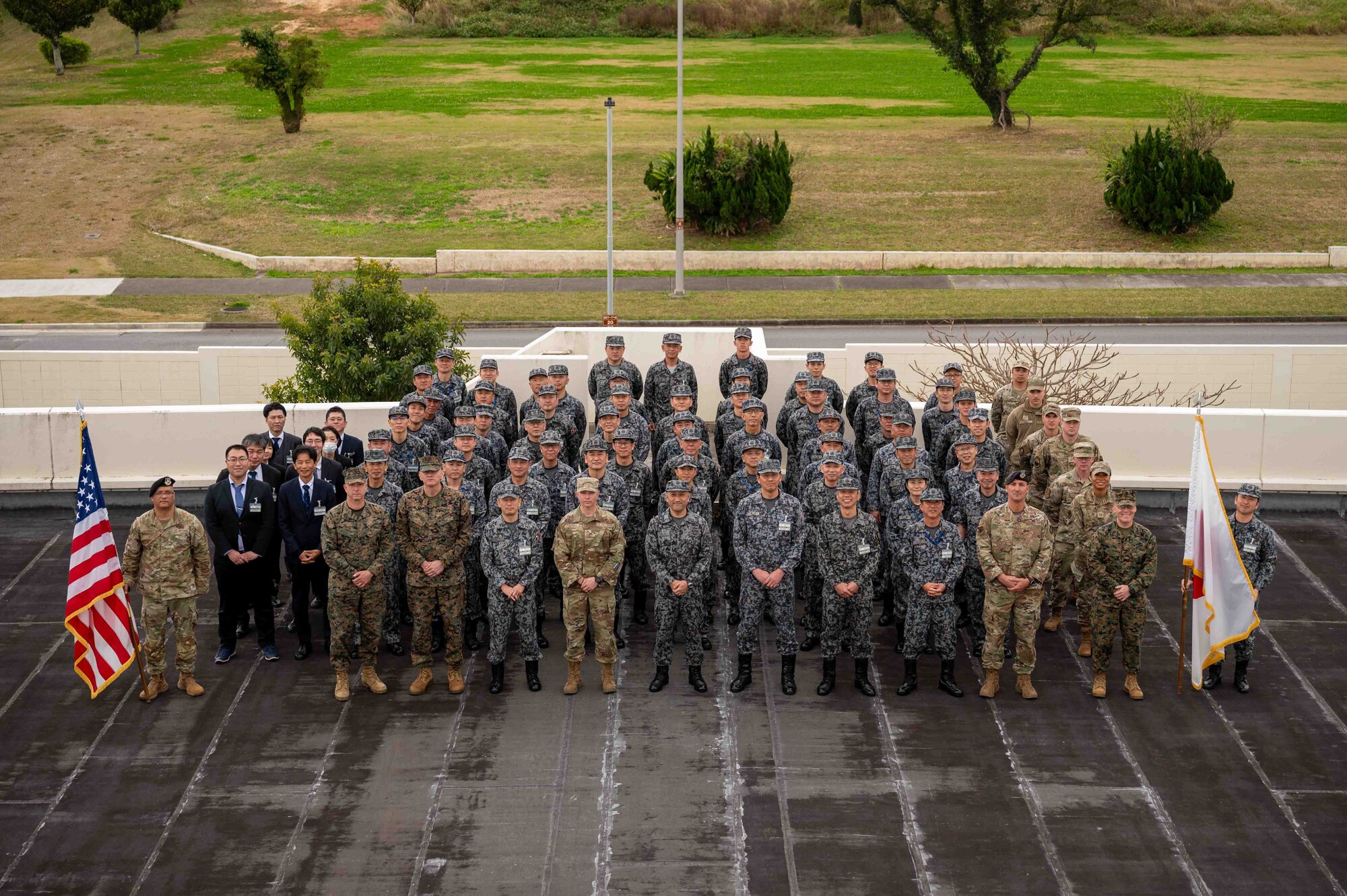 U.S. Air Force, U.S. Marine Corps. and Japan Air Self-Defense Force service members stand for a group photo during a bilateral senior enlisted leadership training at Kadena Air Base, Japan, Feb. 18, 2025.