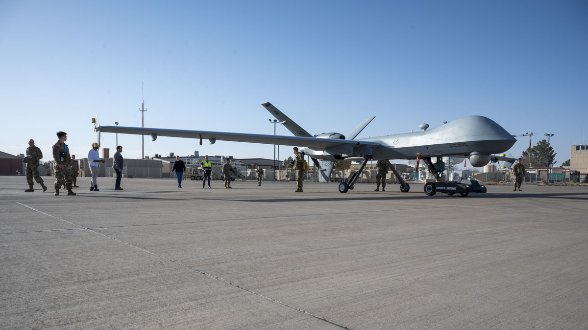 Members of Holloman, TowFLEXX Miltech and Evitado conduct an MQ-9 Reaper towing demonstration at Holloman Air Force Base, New Mexico, Feb. 27, 2025. The 49th Maintenance Group is enhancing mission readiness by partnering with Evitado Technologies and TowFLEXX Miltech to develop a cutting-edge anti-collision solution for aircraft towing, integrating sustainable, emissions-free technologies that align with the Department of Defense’s Green Procurement Program and improve operational safety. (U.S. Air Force photo by Senior Airman Isaiah Pedrazzini)