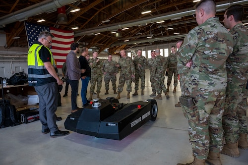 Members of Holloman, TowFLEXX Miltech and Evitado conduct a prototype towing demonstration at Holloman Air Force Base, New Mexico, Feb. 27, 2025. The collaboration between the 49th Maintenance Group, Evitado Technologies, and TowFLEXX Miltech is to advance aircraft towing operations by integrating electric tugs with Light Detection and Ranging sensor collision detection, boosting safety, reducing costs, and supporting the U.S. Air Force’s sustainability and mission readiness objectives. (U.S. Air Force photo by Senior Airman Isaiah Pedrazzini)