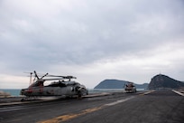 The Nimitz-class aircraft carrier USS Carl Vinson (CVN 70) pulls into Busan, Republic of Korea, for a scheduled port visit, March 2, 2025.