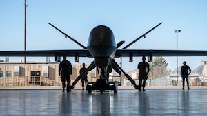 Members of Holloman, TowFLEXX Miltech and Evitado conduct an MQ-9 Reaper towing demonstration at Holloman Air Force Base, New Mexico, Feb. 27, 2025. The 49th Maintenance Group is enhancing mission readiness by partnering with Evitado Technologies and TowFLEXX Miltech to develop a cutting-edge anti-collision solution for aircraft towing, integrating sustainable, emissions-free technologies that align with the Department of Defense’s Green Procurement Program and improve operational safety. (U.S. Air Force photo by Senior Airman Isaiah Pedrazzini)