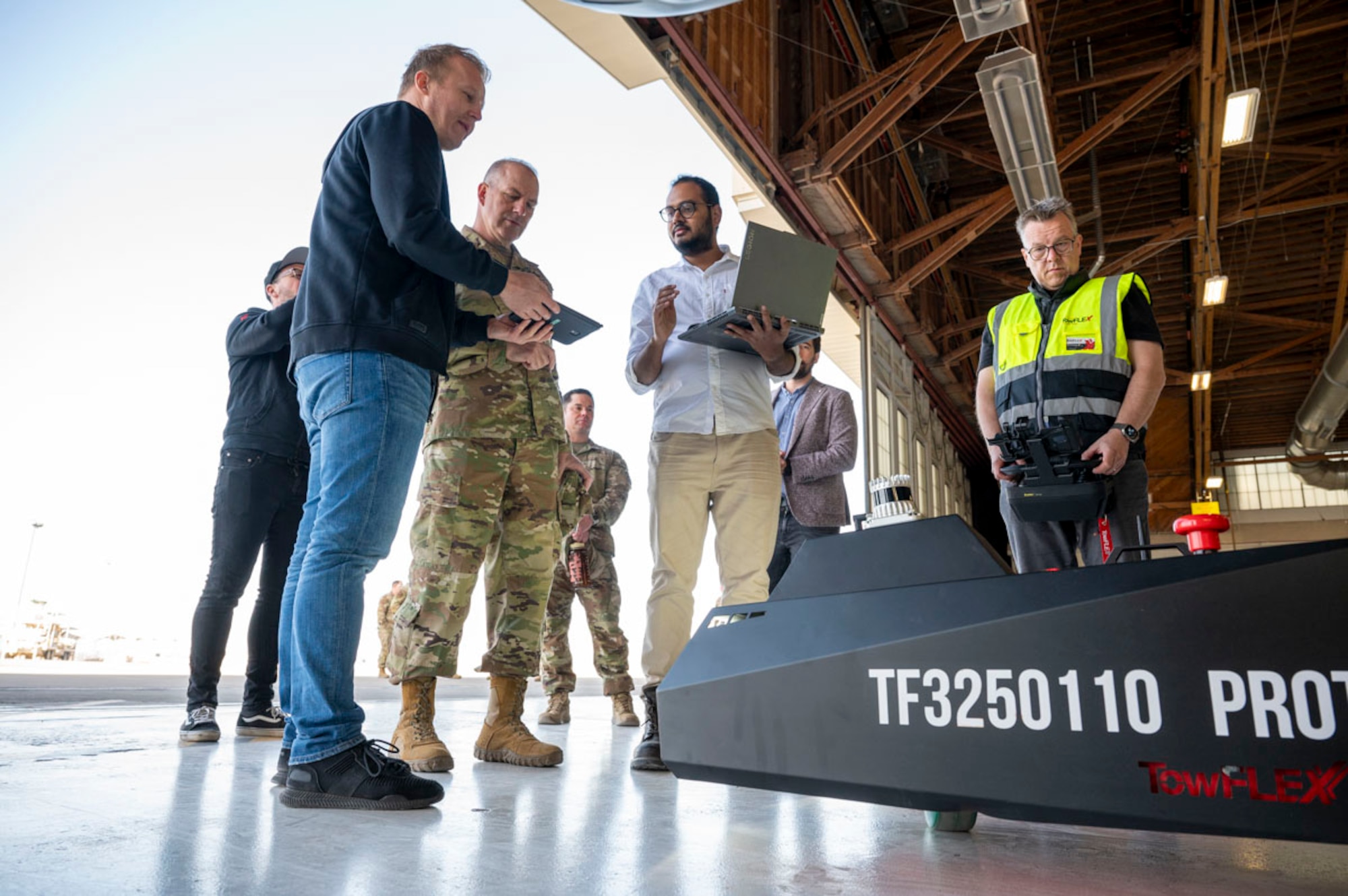 Members of Holloman, TowFLEXX Miltech and Evitado conduct an MQ-9 Reaper towing demonstration at Holloman Air Force Base, New Mexico, Feb. 27, 2025. Through a Phase II Small Business Innovation Research contract, the 49th Maintenance Group is working with Evitado Technologies and TowFLEXX Miltech to revolutionize aircraft towing with electric, remote-controlled tugs, while using advanced LiDAR technology to increase safety and efficiency, reduce manpower needs, and support sustainability goals for the Air Force. (U.S. Air Force photo by Senior Airman Isaiah Pedrazzini)