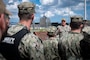 Rear Adm. Brad Collins, Commander, Navy Region Europe, Africa, Central discusses the operational necessity of Naval Support Facility (NSF) Redzikowo and the AEGIS Ashore Missile Defense System (AAMDS) with Sailors assigned to NSF Redzikowo, Aug. 7, 2024.