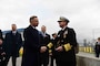 Adm. Stuart B. Munsch, commander, U.S. Naval Forces Europe-Africa (NAVEUR-NAVAF), right, and Polish President Andrzej Duda, left, shake hands after the ribbon cutting ceremony for the transfer of authority of the new Aegis Ashore Missile Defense System at Naval Support Facility Redzikowo, Poland, to NATO Nov. 13, 2024.