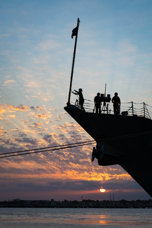 Sailors aboard the Arleigh-Burke class guided-missile destroyer USS Laboon (DDG 58) raise the union jack during morning colors while pulled into port at Naval Station (NAVSTA) Rota, Spain, Aug. 23, 2024.