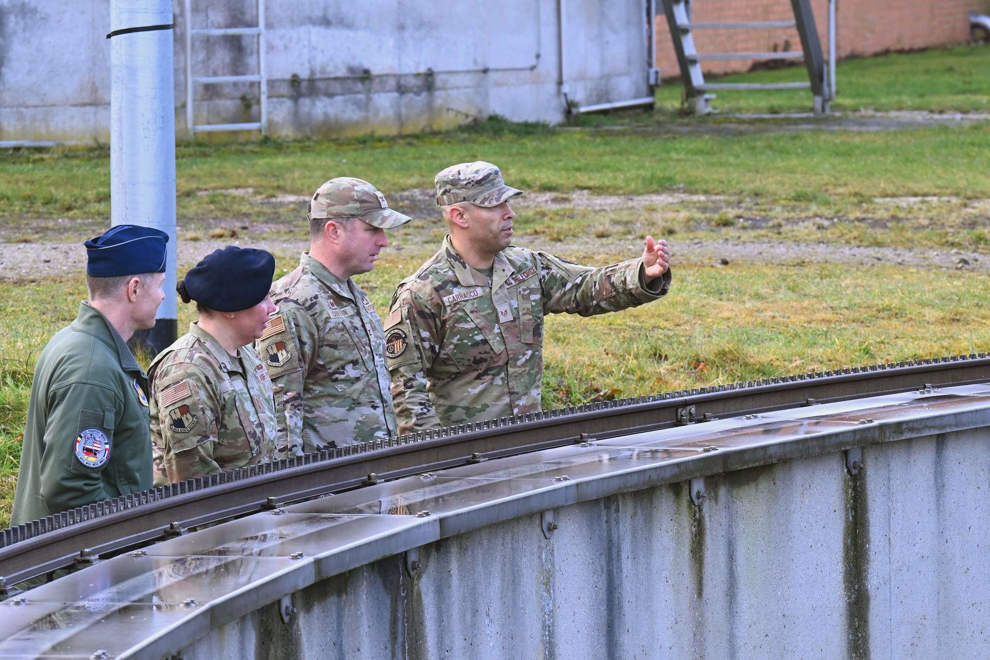 U.S. Air Force Staff Sgt. Ruben Carrasco, 52nd Civil Engineer Squadron water and fuel systems maintenance specialist, briefs 52nd Fighter Wing leadership on wastewater treatment operations at Spangdahlem Air Base, Germany, Feb. 28, 2025. The visit highlighted the base’s efforts to integrate nanobubble technology to enhance mission sustainability and compliance with environmental regulations. (U.S. Air Force photo by Senior Airman Darius Frazier)