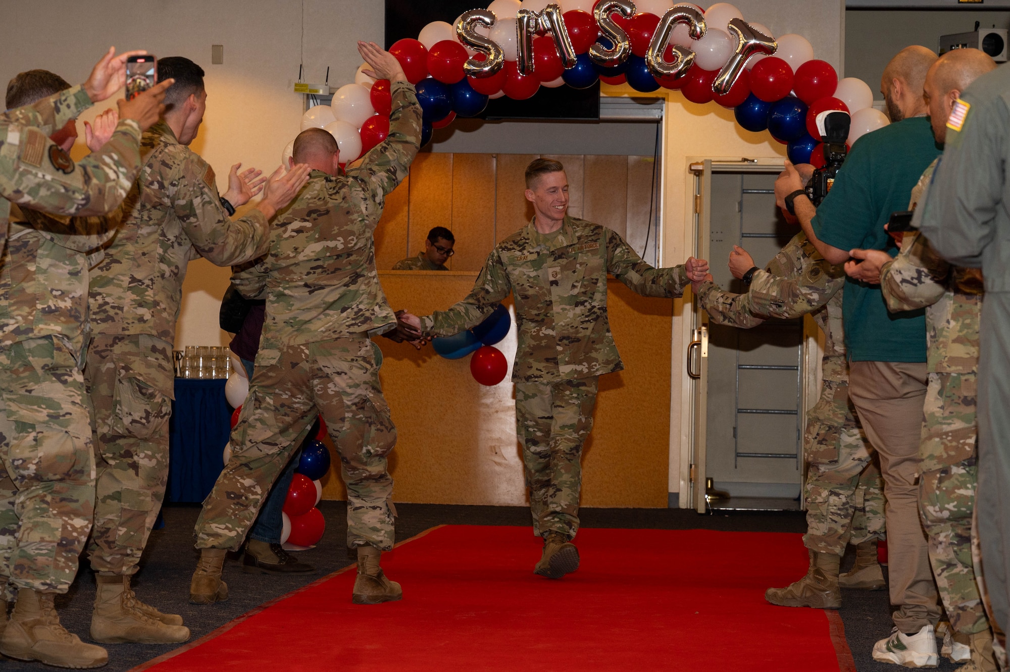 A service member walks down runway.