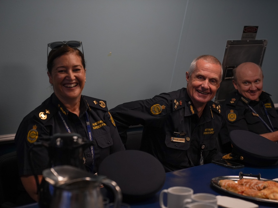 Members from the Royal Australian Boarder Force discuss shared values while on the Coast Guard Cutter Midgett (WMSL 757) in Sydney, Feb. 24, 2025. The United States Coast Guard’s partnership with Australia’s maritime and border forces are a cornerstone of a connected, prosperous, secure, and resilient Pacific. (U.S. Coast Guard photo by Petty Officer 3rd Class Jennifer Nilson)