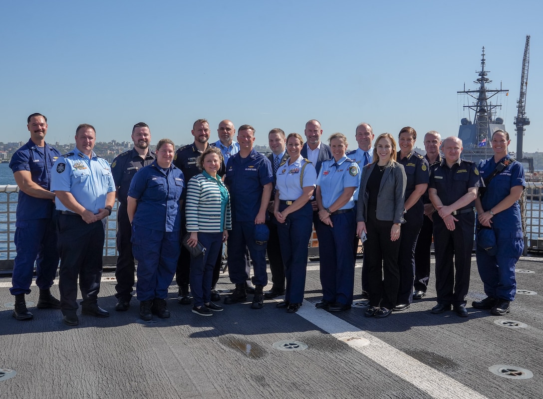 Members from the United States Consulate in Sydney, Royal Australian Border Force, New South Wales Police, and Coast Guard Cutter Midgett (WMSL 757) stand on the flight deck of the Midgett, following a law enforcement event with Australian partners in Sydney, Feb. 24, 2025. The Coast Guard’s regional presence in Oceania and forward-leaning posture reinforces the U.S. Coast Guard’s unwavering commitment to supporting Australia in ensuring maritime safety and security. (U.S. Coast Guard photo by Petty Officer 3rd Class Jennifer Nilson)