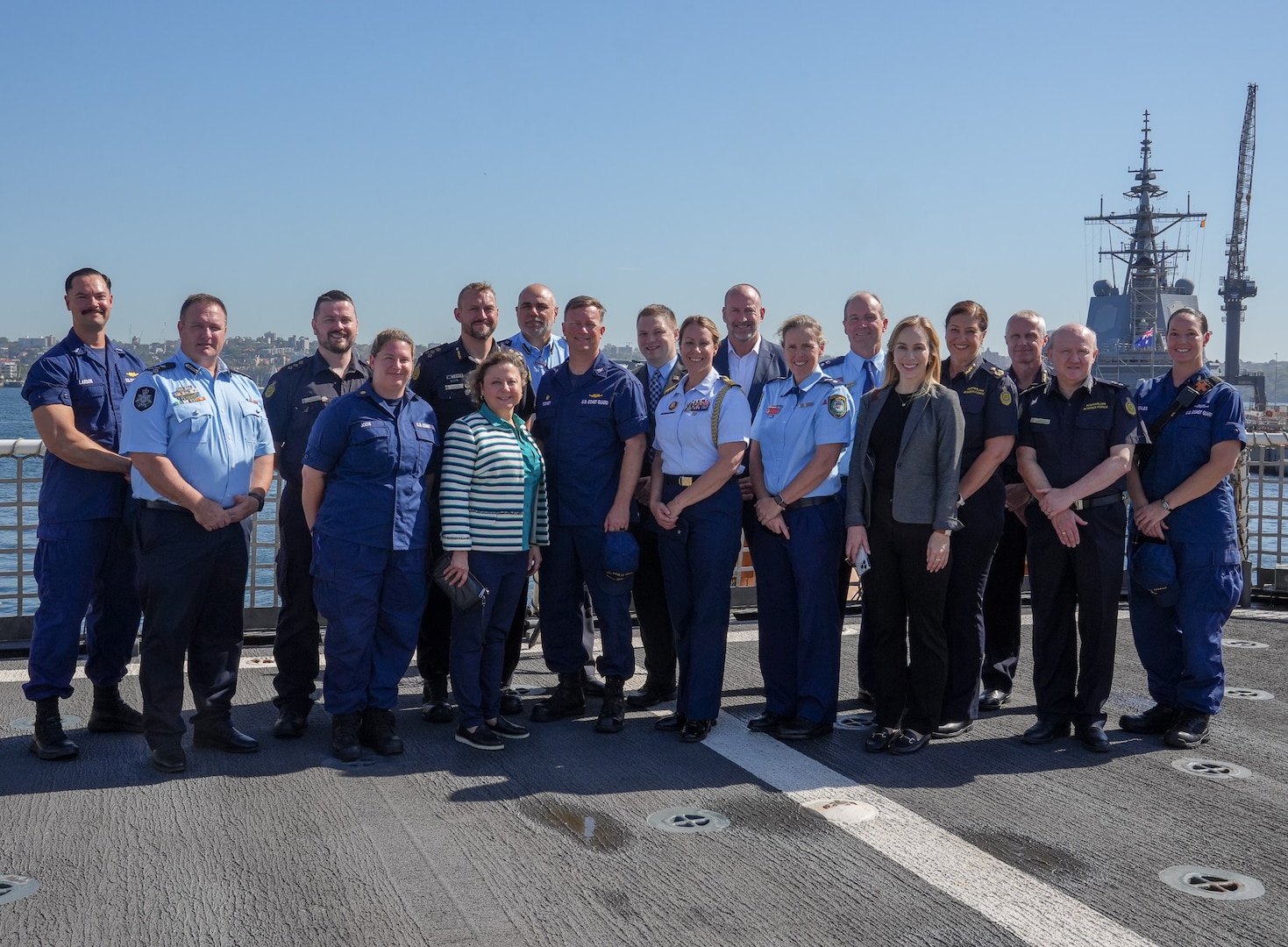 Members from the United States Consulate in Sydney, Royal Australian Border Force, New South Wales Police, and Coast Guard Cutter Midgett (WMSL 757) stand on the flight deck of the Midgett, following a law enforcement event with Australian partners in Sydney, Feb. 24, 2025. The Coast Guard’s regional presence in Oceania and forward-leaning posture reinforces the U.S. Coast Guard’s unwavering commitment to supporting Australia in ensuring maritime safety and security. (U.S. Coast Guard photo by Petty Officer 3rd Class Jennifer Nilson)