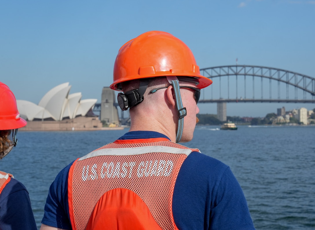 Fireman Davis Adams, an enlisted member onboard Coast Guard Cutter Midgett (WMSL 757), observes the skyline as Midgett moors in Sydney, Feb. 27, 2025. The Coast Guard’s regional presence in Oceania and forward-leaning posture reinforces the Coast Guards unwavering commitment to supporting Australia in ensuring maritime safety and security. (U.S. Coast Guard photo by Petty Officer 3rd Class Jennifer Nilson)