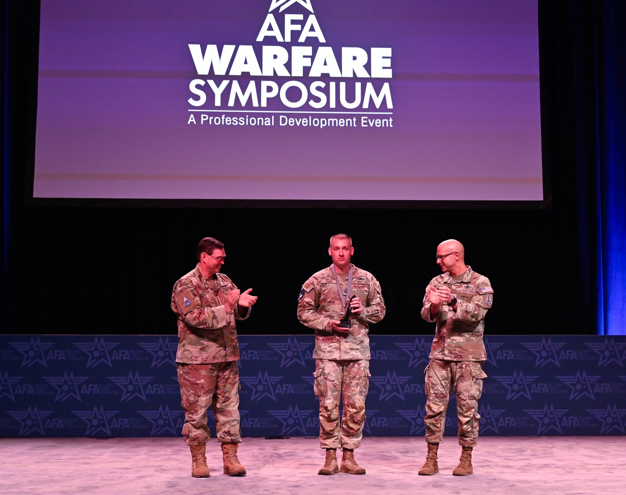 A military member receives an award.
