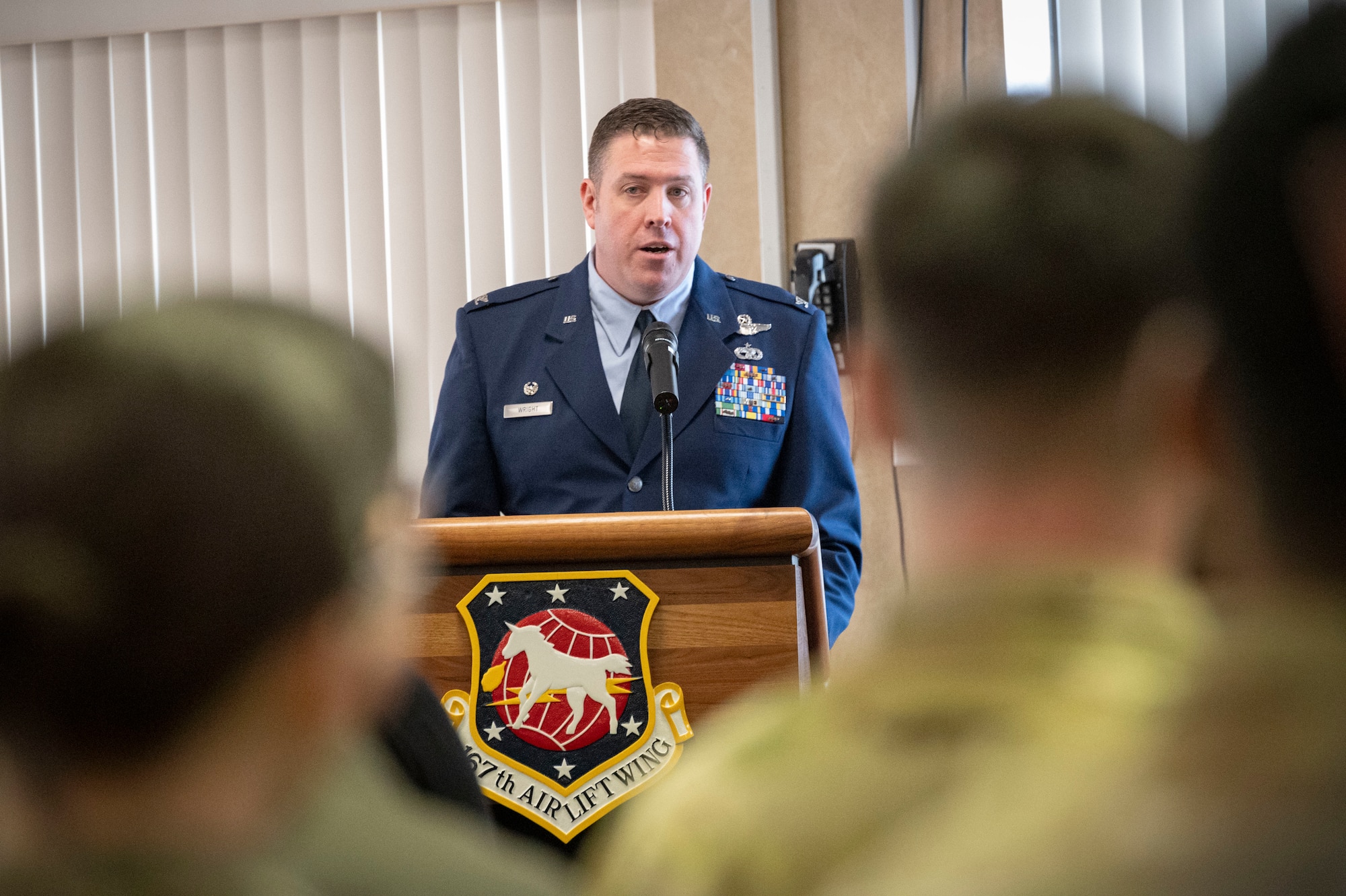 a man stand at a podium