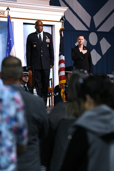 Man and woman in uniform standing on stage