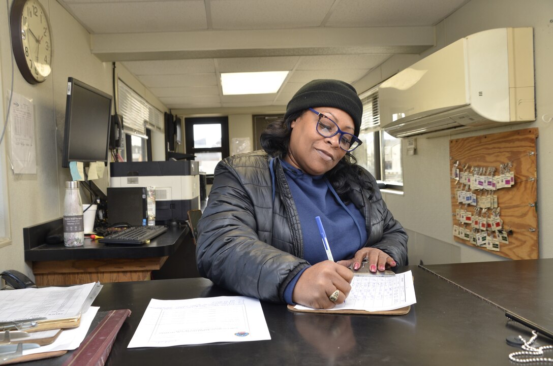 Women writes on document