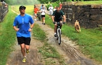 Coast Guard Lt. j.g. Kevin Koski and Randy Perry, participate in the 12th annual Tom's Run relay race along the Chesapeake and Ohio Canal (U.S. Coast Guard photo by Petty Officer 3rd Class Robert Brazzell)