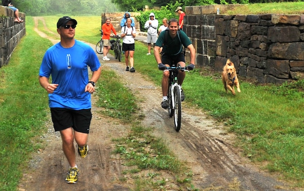 Coast Guard Lt. j.g. Kevin Koski and Randy Perry, participate in the 12th annual Tom's Run relay race along the Chesapeake and Ohio Canal (U.S. Coast Guard photo by Petty Officer 3rd Class Robert Brazzell)