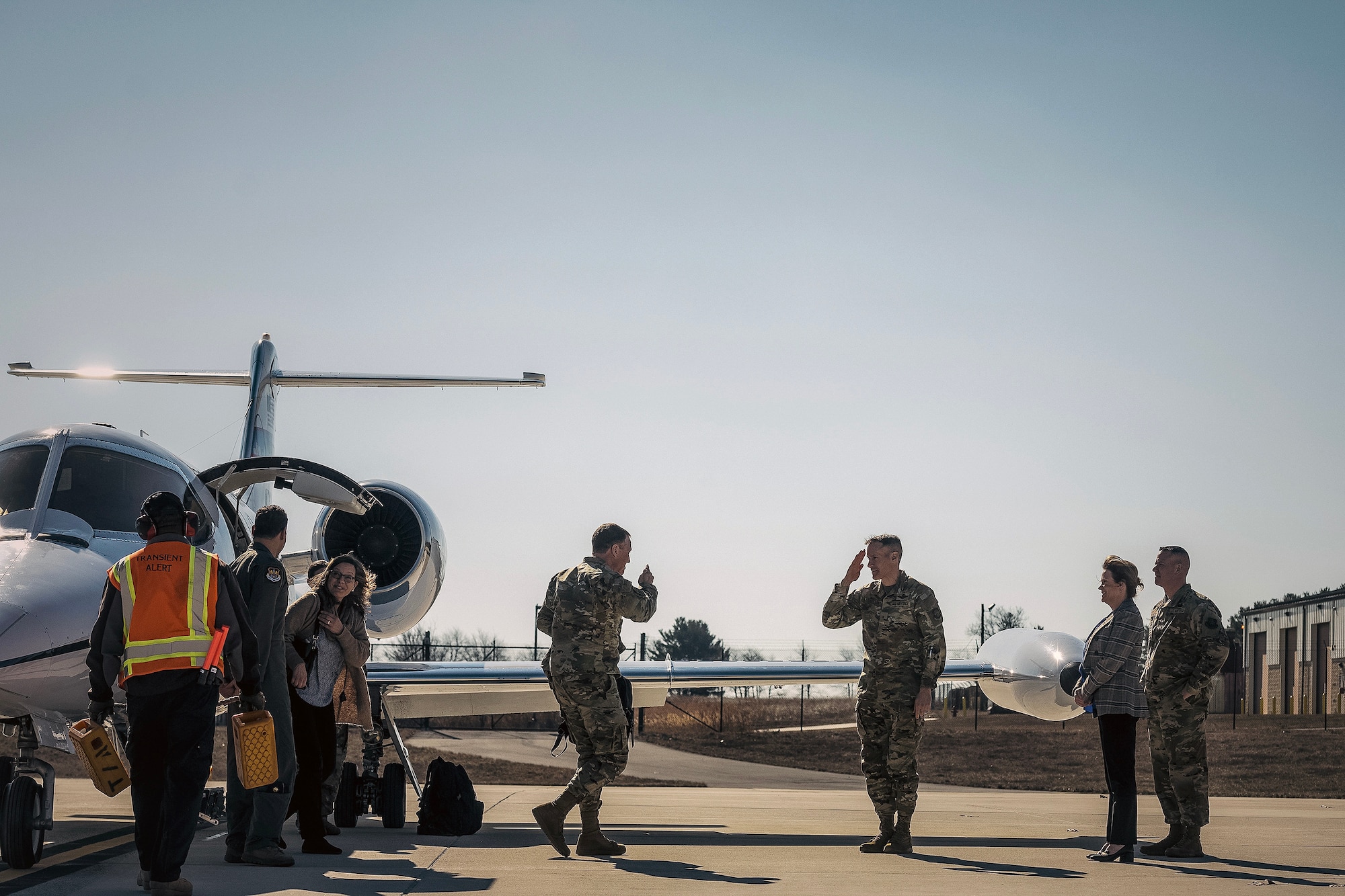 U.S. Air Force Gen. Johnny Lamontagne, commander of Air Mobility Command, and Chief Master Sgt. Jamie Newman, AMC command chief, arrive at Joint Base McGuire-Dix-Lakehurst, N.J., Feb. 26, 2025. Brig. Gen. Stephen Snelson, U.S. Air Force Expeditionary Center commander, greeted the AMC team and led them on a tour of various Expeditionary Center facilities. (U.S. Air Force photo by Staff Sgt. Austin Knox)