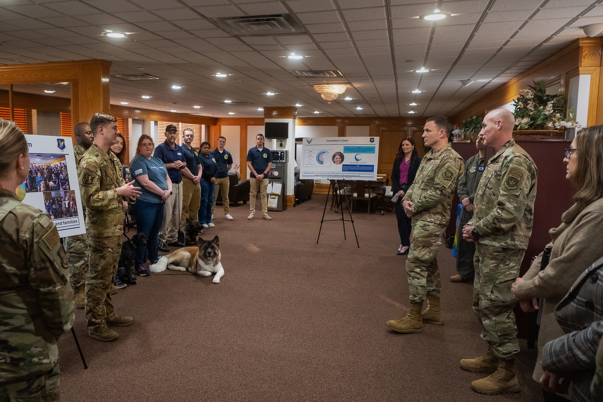 U.S. Air Force Gen. Johnny Lamontagne, commander of Air Mobility Command, and Chief Master Sgt. Jamie Newman, AMC command chief, receive a briefing from the Sean’s Room team at Joint Base McGuire-Dix-Lakehurst, N.J., Feb. 26, 2025. Sean’s Room is a resiliency program that provides informal mental health support, a sense of belonging and licensed counselor support. (U.S. Air Force photo by Staff Sgt. Austin Knox)