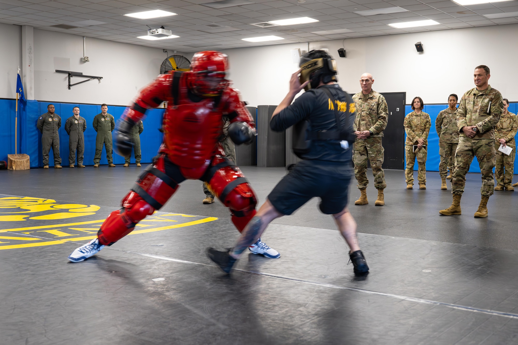 Phoenix Raven instructors demonstrate hand-to-hand combatives to U.S. Air Force Gen. Johnny Lamontagne, commander of Air Mobility Command, and Chief Master Sgt. Jamie Newman, AMC command chief, at Joint Base McGuire-Dix-Lakehurst, N.J., Feb. 26, 2025. During the visit, Lamontagne and Newman underscored AMC’s initiatives centered on developing Mission Ready Airmen, enhancing operational capabilities and strengthening relationships across the military community. (U.S. Air Force photo by Capt. Braxton Williams)