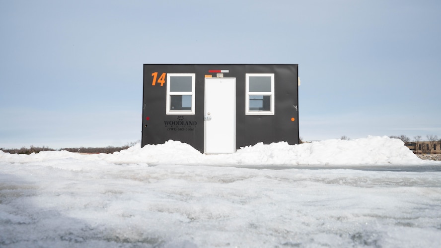 An ice fishing shack sits on the ice at Devils Lake, North Dakota, Feb.  25, 2025. These shacks provide shelter and warmth to ice fishermen during the ice fishing season in North Dakota, where temperatures are consistently below zero. (U.S. Air Force photo by Senior Airman Kendra A. Ransum)