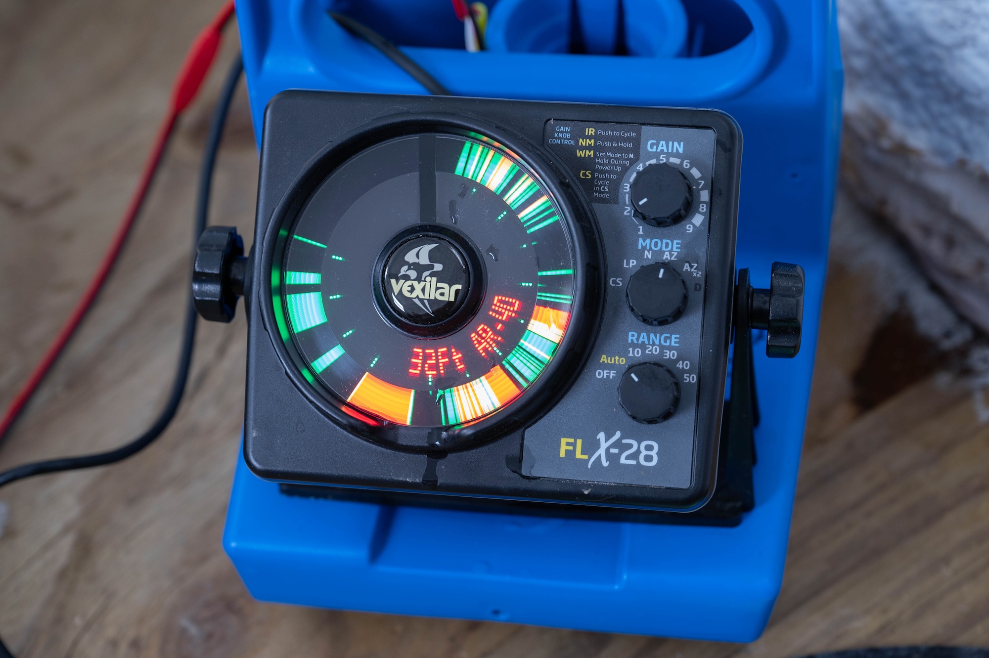 A fishing sonar is used for ice fishing on Devils Lake, North Dakota, Feb. 25, 2025. The sonar was used to help locate fish and determine the depth at which they were swimming. (U.S. Air Force photo by Senior Airman Kendra A. Ransum)