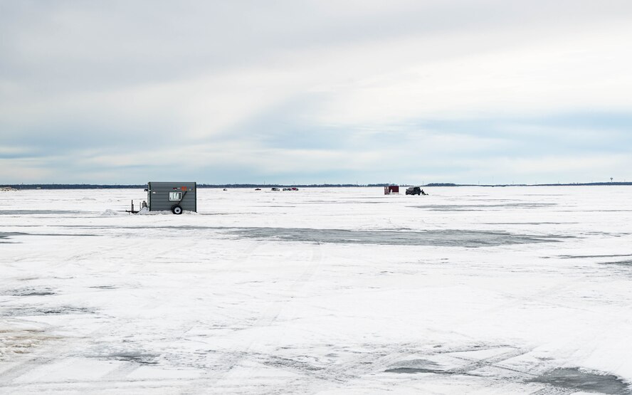 Ice fishing shacks sit on the ice at Devils Lake, North Dakota, Feb. 25, 2025. These shacks provide shelter and warmth to ice fishermen during the ice fishing season in North Dakota, where temperatures are consistently below zero. (U.S. Air Force photo by Senior Airman Kyle Wilson)