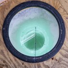 An ice fishing hole is drilled into the ice on Devils Lake, North Dakota, Feb. 25, 2025. At the time, the ice on Devils Lake was about 30 inches thick. The ice on the lake needs to be at least 4 inches thick for a person to safely walk on it. (U.S. Air Force photo by Senior Airman Kyle Wilson)