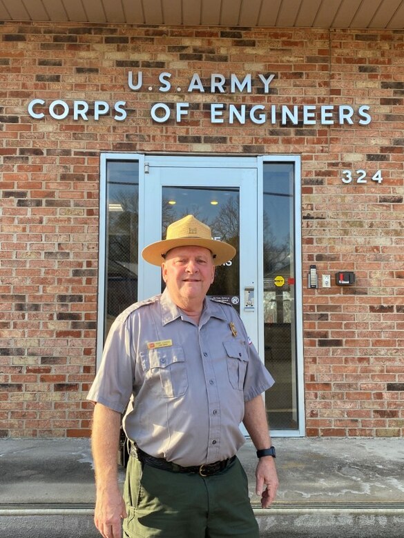 man standing in front of a building