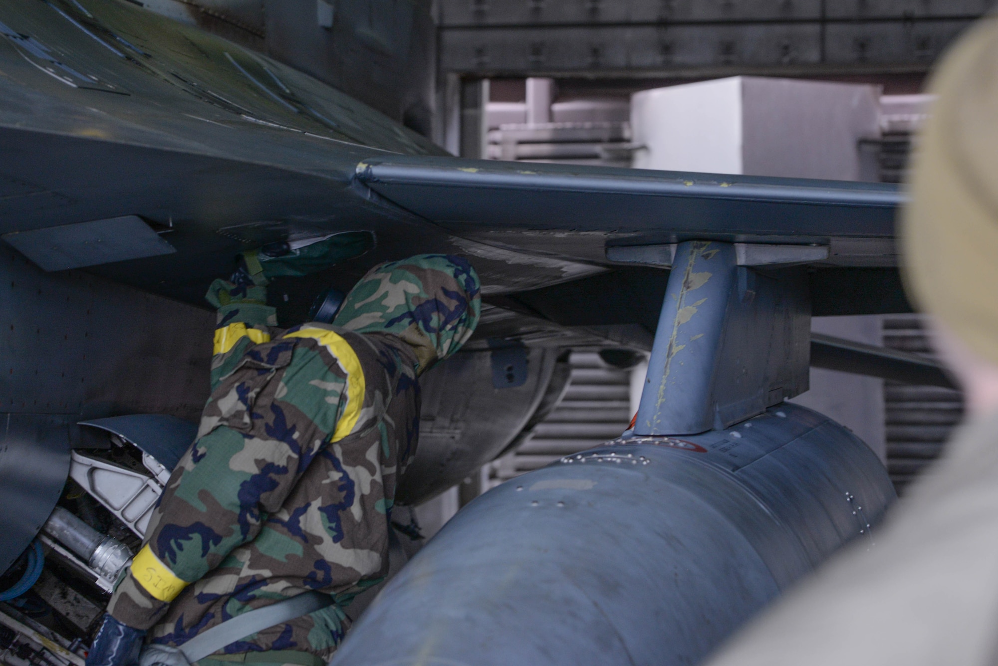 U.S. Air Force Staff Sgt. O’Brine Brewster, 51st Maintenance Group quality assurance inspector, simulates decontaminating an F-16 Fighting Falcon assigned to the 36th Fighter Squadron during a hands-on training at Osan Air Base, Republic of Korea, Feb. 28, 2025. After a chemical, biological, radioactive, or nuclear attack, aircraft must be decontaminated to ensure aircrew safety, enabling continued combat airpower generation in response to enemy attacks. (U.S. Air Force photo by Staff Sgt. Kahdija Slaughter)