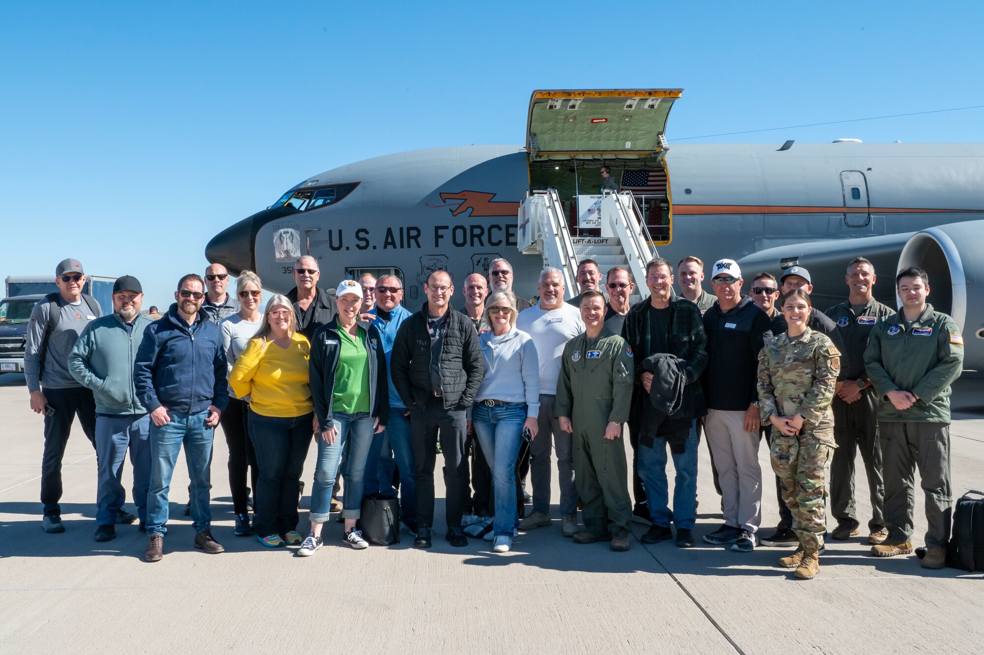 944th Fighter Wing Honorary Commanders, 944th Fighter Wing military leadership, and Arizona Air National Guard 161st Air Refueling Wing crew members gather for a group photo in front of the KC-135 Stratotanker after a memorable in-flight refueling mission, Goldwater Air National Guard Base, Ariz., Nov. 8, 2024. This program strengthens community-military ties and fosters understanding of the Air Force's critical role. (U.S. Air Force photo by Senior Airman Alexis Orozco)