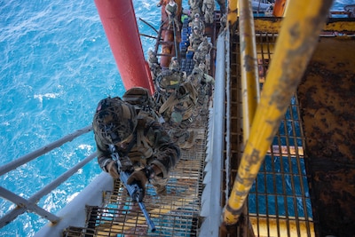 U.S. Naval Special Warfare (NSW) operators and Armed Forces of the Philippines service members rehearse securing a gas and oil platform during a joint combined exchange training (JCET) event in El Nido, Philippines, March 1, 2025.
