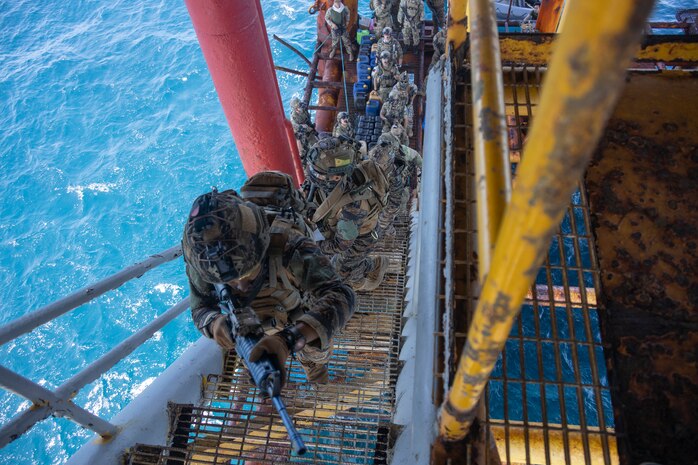 U.S. Naval Special Warfare (NSW) operators and Armed Forces of the Philippines service members rehearse securing a gas and oil platform during a joint combined exchange training (JCET) event in El Nido, Philippines, March 1, 2025.