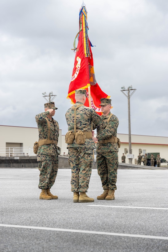 U.S. Marine Corps Col. Peter Eltringham, right, passes the 12th Littoral Combat Teams colors to Lt. Col. Jacob Godby during the designation ceremony of 12th LCT on Camp Hansen Okinawa, Japan, March 3, 2025. During the ceremony, 12th Marine Littoral Regiment welcomed its third and final subordinate element, 12th LCT. The establishment of this renowned unit strengthens the MLR's ability to integrate sensing, fires, and maneuver to support maritime campaigns and reinforces the Marine Corps’ commitment to countering evolving threats in the Indo-Pacific. Eltringham, a native of Rhode Island is the commanding officer of 12th MLR and Godby, a native of Virginia, is the commanding officer of 12th LCT, 12th MLR, 3d Marine Division. (U.S. Marine Corps photo by Staff Sgt. JVonnta Taylor)