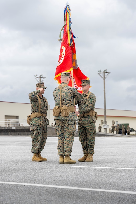 U.S. Marine Corps Col. Peter Eltringham, right, passes the 12th Littoral Combat Teams colors to Lt. Col. Jacob Godby during the designation ceremony of 12th LCT on Camp Hansen Okinawa, Japan, March 3, 2025. During the ceremony, 12th Marine Littoral Regiment welcomed its third and final subordinate element, 12th LCT. The establishment of this renowned unit strengthens the MLR's ability to integrate sensing, fires, and maneuver to support maritime campaigns and reinforces the Marine Corps’ commitment to countering evolving threats in the Indo-Pacific. Eltringham, a native of Rhode Island is the commanding officer of 12th MLR and Godby, a native of Virginia, is the commanding officer of 12th LCT, 12th MLR, 3d Marine Division. (U.S. Marine Corps photo by Staff Sgt. JVonnta Taylor)