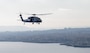 An MH-60S Seahawk helicopter assigned to the “The Dragon Whales” of Helicopter Sea Combat Squadron (HSC) 28, flies over Taormina, Sicily, Dec. 20, 2024.