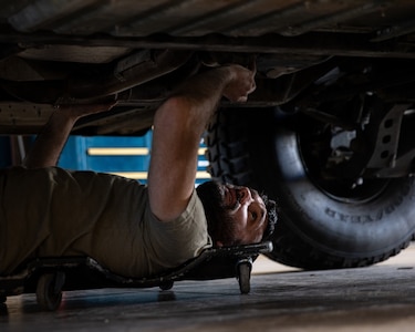 Oklahoma Army National Guard member Sgt. David Quinn, a mechanic with a team from Field Maintenance Shop Six, inspects a humvee during the Mechanic of the Year competition held at the Combined Support Maintenance Shop in Norman, Oklahoma, Feb. 26, 2025. The Guardsmen came together for the fourth annual competition, teaming up to showcase their mechanic skills and connect with fellow competitors.(Oklahoma National Guard photo by Spc. Danielle Rayon)