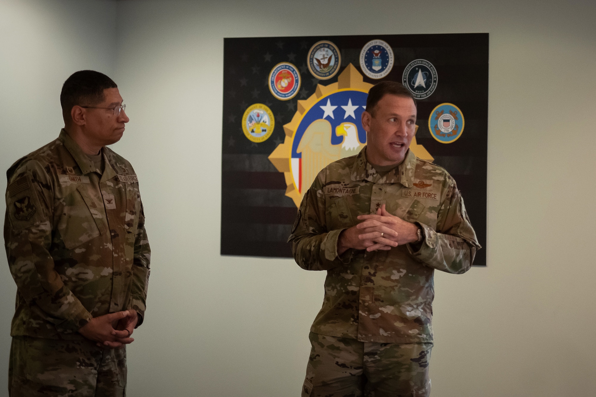 U.S. Air Force Col. Anthony Smith, Joint Base McGuire-Dix-Lakehurst and 87th Air Base Wing commander stands with Gen. Johnny Lamontagne, commander of Air Mobility Command, as he thanks members from the 87th Civil Engineer Group at Joint Base McGuire-Dix-Lakehurst, N.J., Feb. 27, 2025. Lamontagne’s visit highlighted the importance of innovation, teamwork, and resilience among our Airmen. (U.S. Air Force photo by Staff Sgt. Austin Knox)
