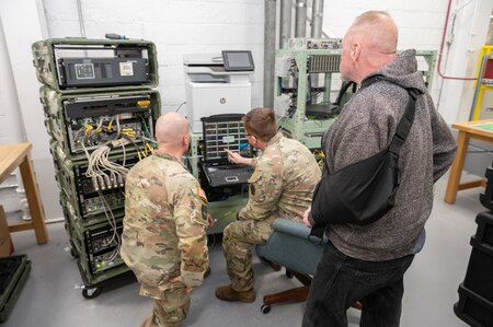 Photo of depot employees training Soldiers on the CPN system