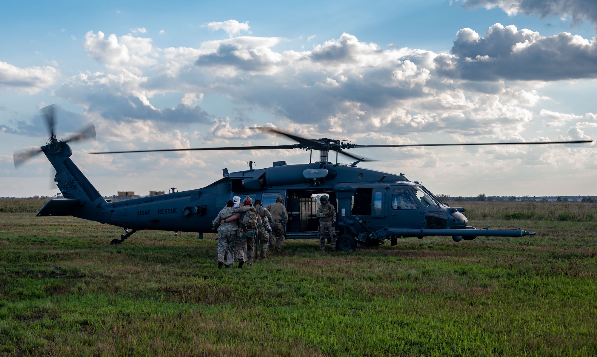 Airmen from the 920th Rescue Wing, including Tactical Medical Augmentation Team members, Security Forces, and rescue personnel, conducted a simulated medical evacuation during MEDBEACH 25 at Avon Park Auxiliary Airfield, Feb. 26, 2025. Citizen Airmen from the 920th Aeromedical Staging Squadron, alongside joint partners, honed their medical and patient evacuation skills during hands-on training, reinforcing en route patient staging capabilities and wartime medical operations. (U.S. Air Force photo by Tech. Sgt. Darius Sostre-Miroir)