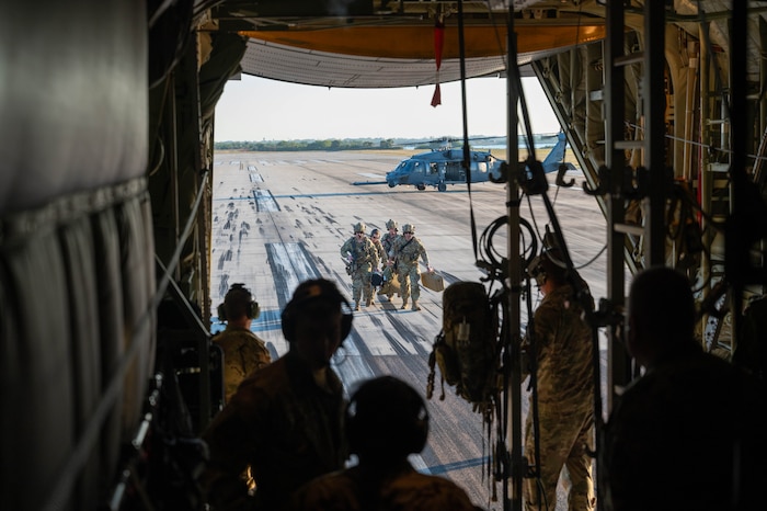 Members of the 908th Rescue Squadron and 920th Aeromedical Staging Squadron transload a patient onto an HC-130J Combat King II aircraft for transport from Patrick Space Force Base to MacDill Air Force Base, Fla., Feb. 26, 2025. Citizen Airmen from the 920th ASTS, alongside joint and international partners, honed their medical and patient evacuation skills during MEDBEACH 2025, a hands-on training exercise reinforcing en route patient staging capabilities and wartime medical operations. (U.S. Air Force photo by Tech. Sgt. Kristen Pittman)
